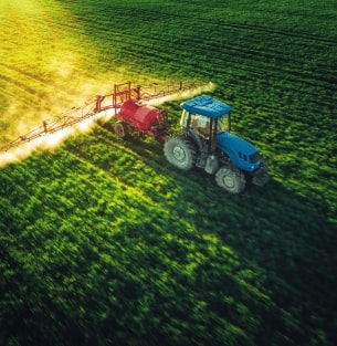 Agricultural tractors and harvesters